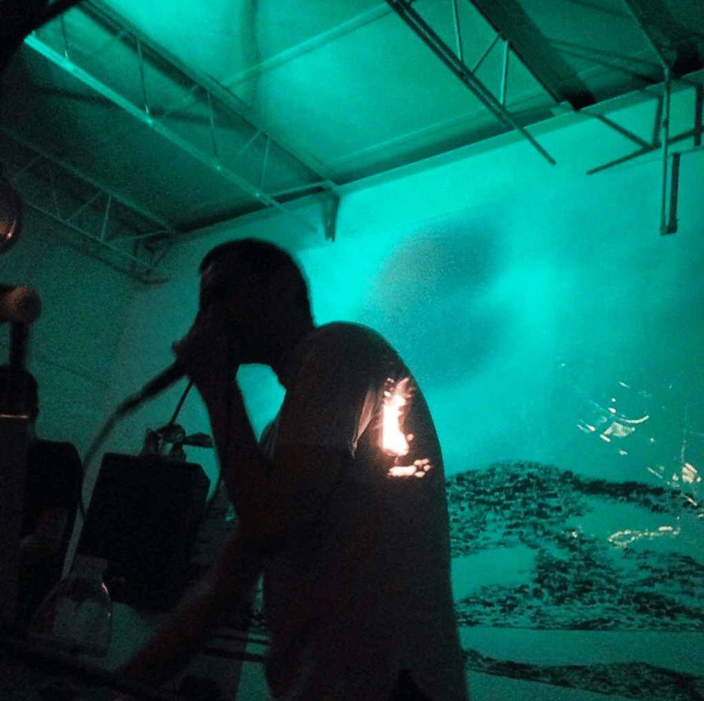 Silhouette of a man singing in Miami Music Club